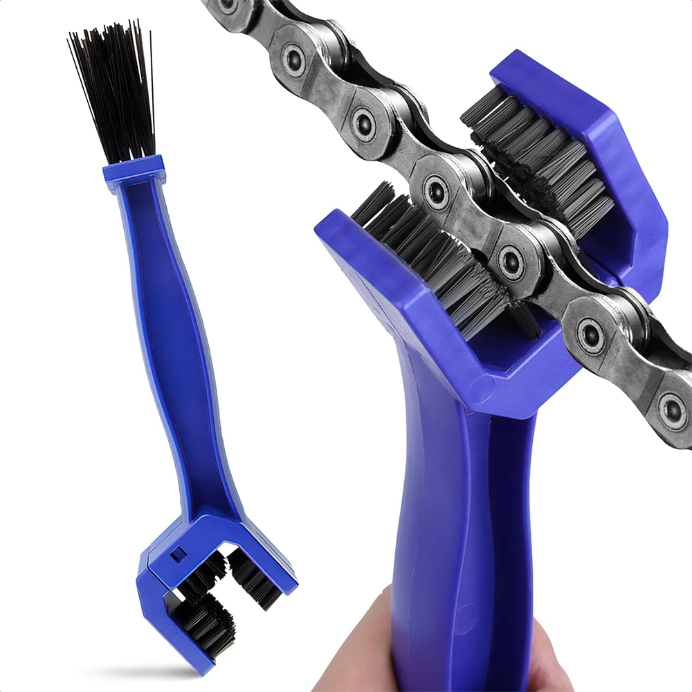 Bike chain cleaning tool with blue handles and black bristles on a white background